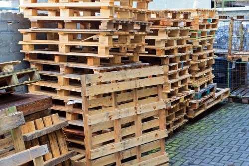 Worker wearing PPE and safety vest preparing for a collection shift